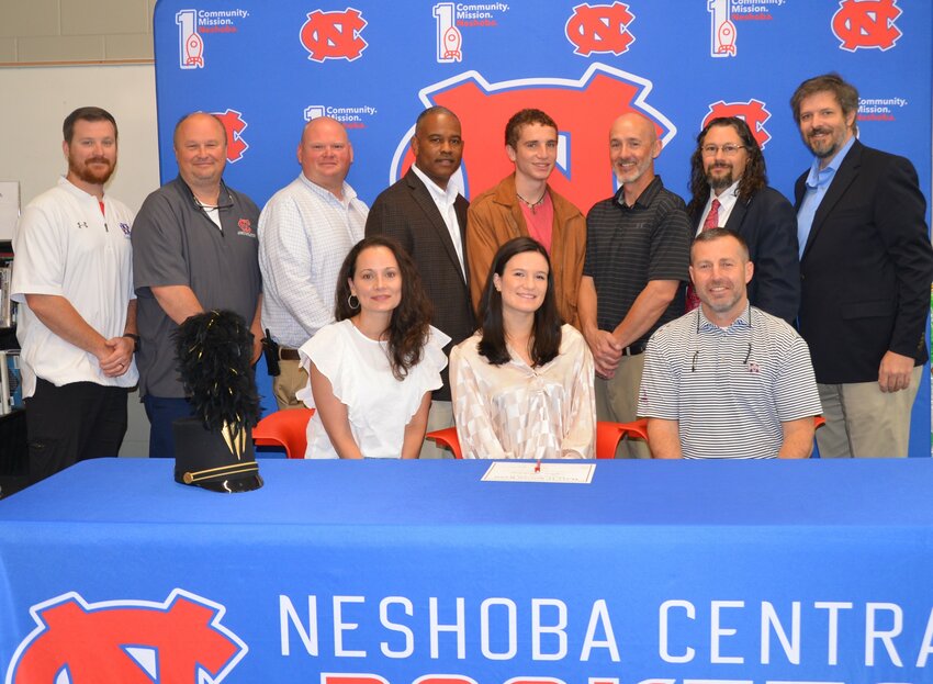 Neshoba Central’s Alex Stribling signed with East Central Community College to further her education and be a member of the Wall O’ Sound Band. Pictured, front from left, are her mother April Burton, Alex Stribling, and her father Heath Stribling (Back) Assistant Principal Jonathan Walker, Principal Jason Gentry, Assistant Principal Brent Pouncy Assistant Principal LaShon Horne, her brother Shot Stribling, Josh Burton and Band Director Daniel Wade, and ECCC Representative Justin Sharp.
